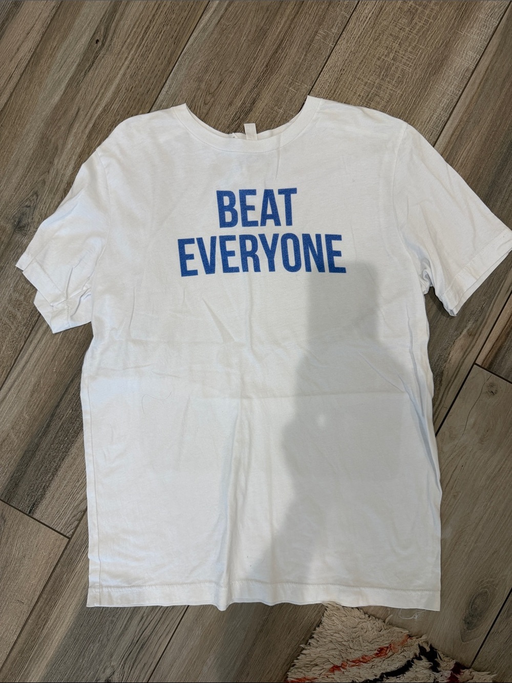 Bella Canvas White Short Sleeve Tee with Blue "BEAT EVERYONE" Graphic